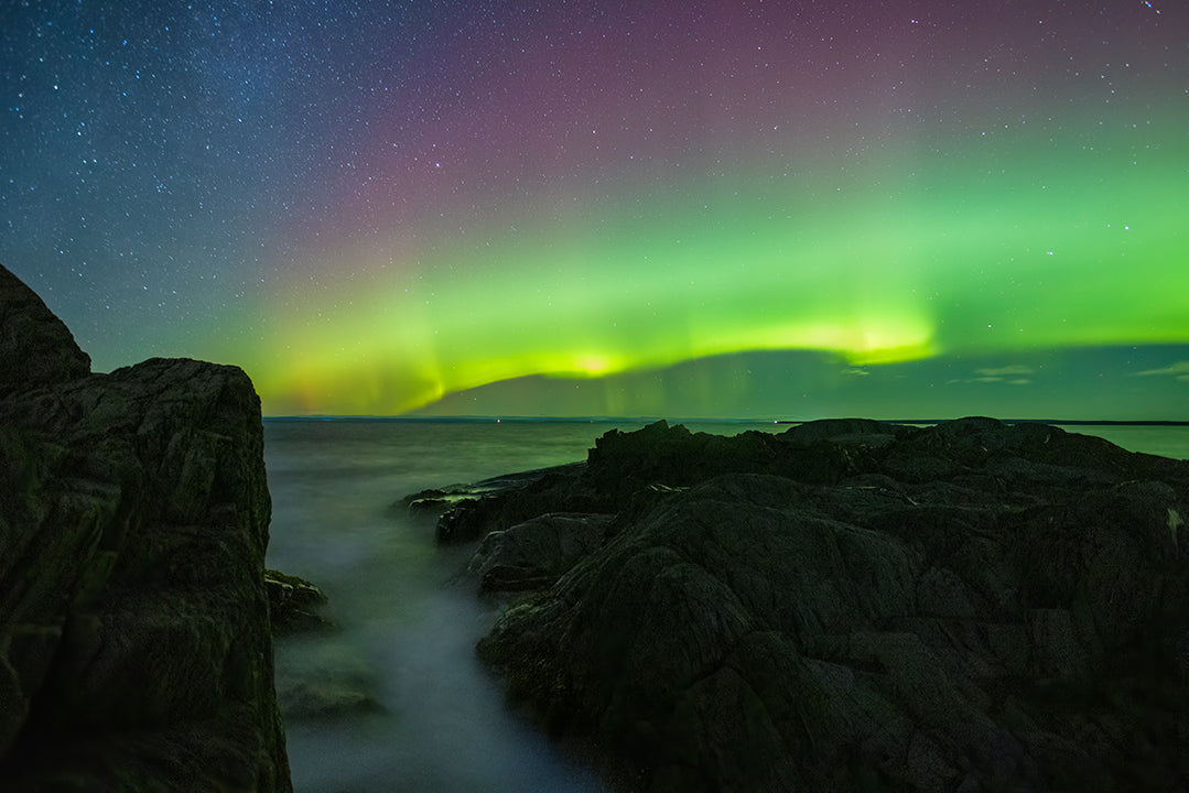 Incoming tide under the aurora